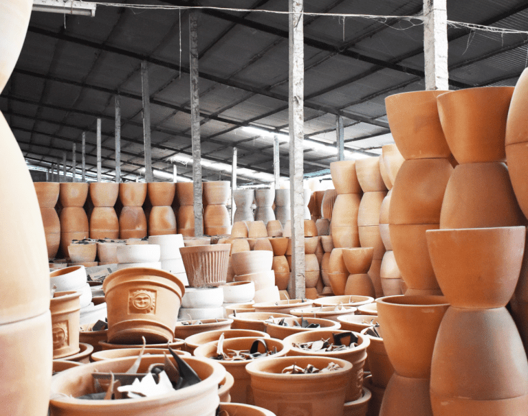 Stacks of terracotta pots and planters in the warehouse